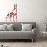 metal doberman wall art in red over couch