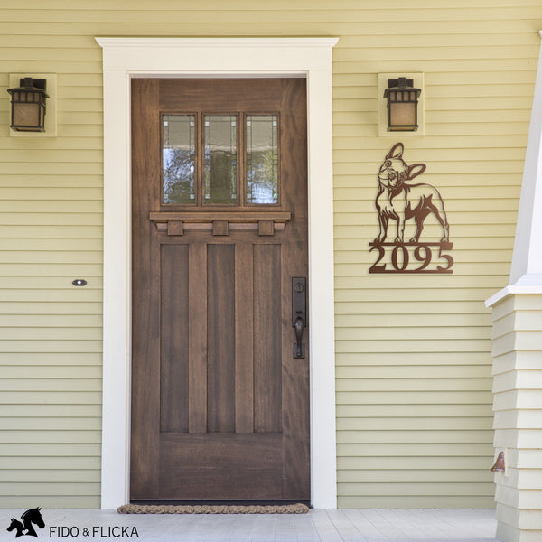 copper frenchie house number sign on front of house