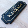 Personalized horse stall sign with brushed gold acrylic letters on black wood backing reading KASKADE by Fido and Flicka