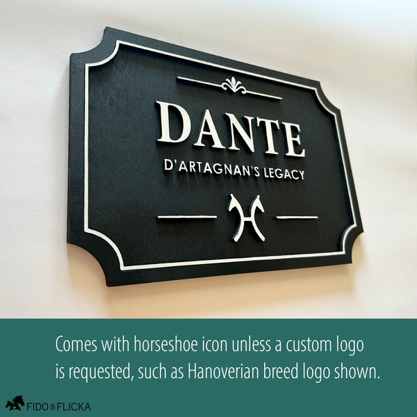 Personalized horse stall sign in layered Baltic birch with white on black finish, shown with custom Hanoverian breed logo. Standard design includes horseshoe icon unless a custom logo is requested