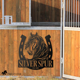 farm and ranch personalized metal horseshoe and horse sign on barn wall