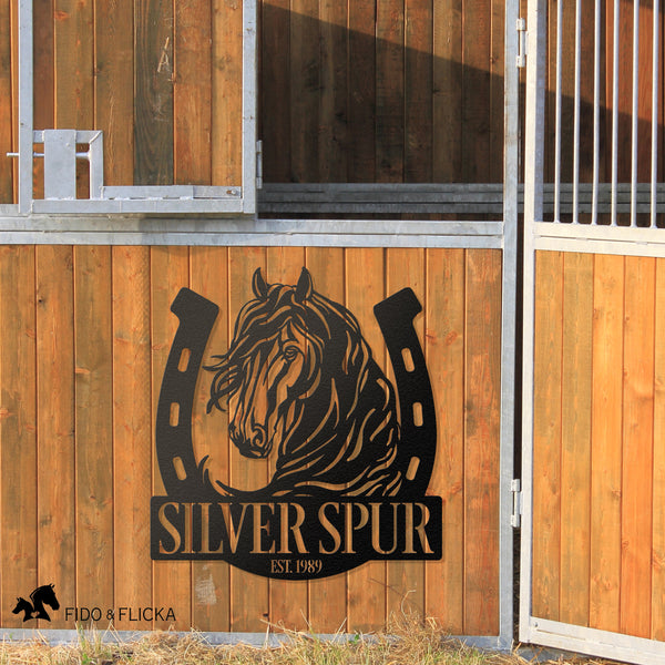 farm and ranch personalized metal horseshoe and horse sign on barn wall