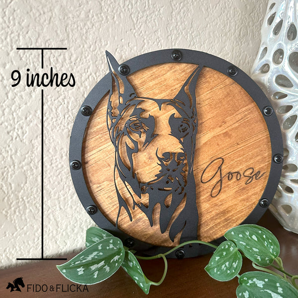 round Doberman sign with rivets metal wood