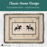 Beige blanket with horse and rider design on a wooden floor, featuring text about timeless design.