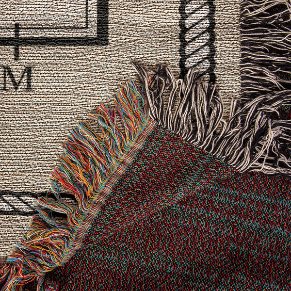 Close-up of woven cotton dressage arena blanket showing detailed rope border, arena lettering, and colorful fringe edges