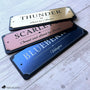 Three personalized horse stall signs in brushed gold, copper, and blue metallic finishes with black acrylic backing, showcasing custom engraved horse name plaques by Fido & Flicka.