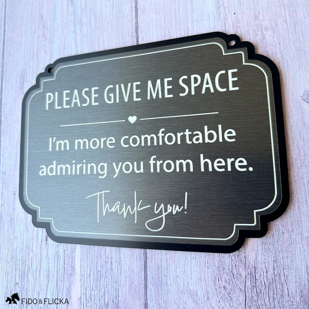 Brushed charcoal horse stall sign with white engraving reading “Please Give Me Space, I’m more comfortable admiring you from here.”
