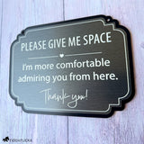 Brushed charcoal horse stall sign with white engraving reading “Please Give Me Space, I’m more comfortable admiring you from here.”