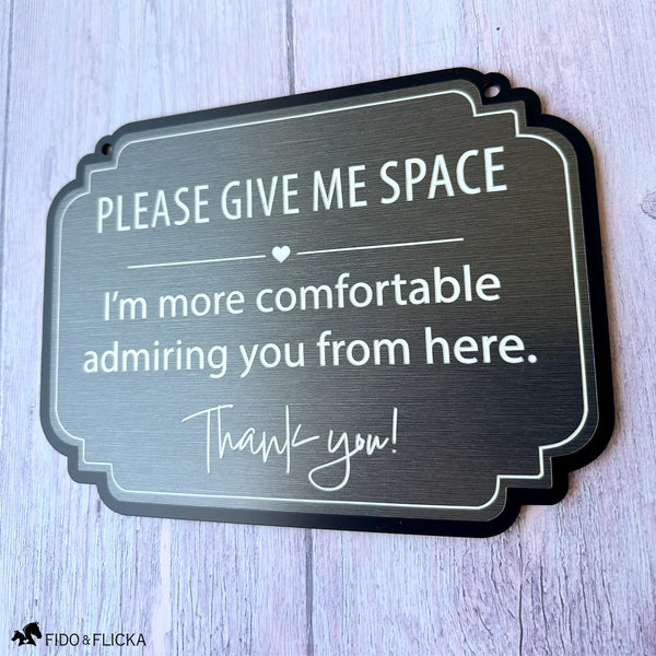Brushed charcoal horse stall sign with white engraving reading “Please Give Me Space, I’m more comfortable admiring you from here.”