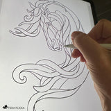 Artist sketching the original design for Noble Drift horse wall art on a digital tablet, capturing the flowing lines and abstract form.