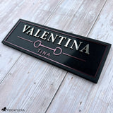 Black custom horse stall name plate with raised silver lettering, Merlot metallic accents, horse bit emblem, and the name Valentina.