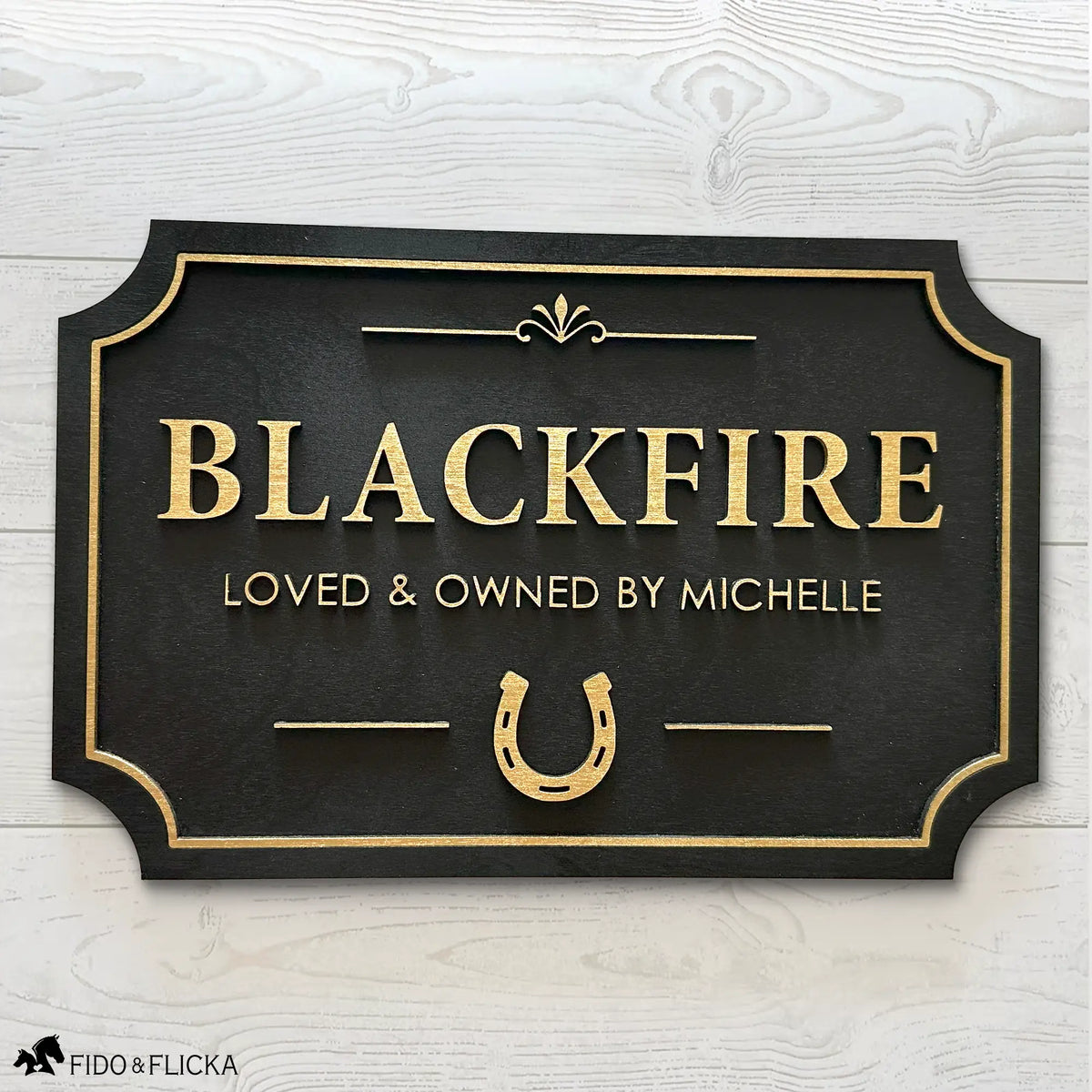Custom horse stall sign made from layered Baltic birch wood, gold on black finish with personalized name and horseshoe design – durable equestrian barn name plaque.
