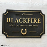 Custom horse stall sign made from layered Baltic birch wood, gold on black finish with personalized name and horseshoe design – durable equestrian barn name plaque.