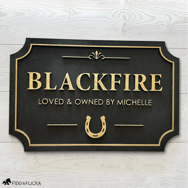 Custom horse stall sign made from layered Baltic birch wood, gold on black finish with personalized name and horseshoe design – durable equestrian barn name plaque.