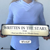 Person holding an 18-inch personalized horse stall sign to demonstrate the size of the premium engraved acrylic plaque.
