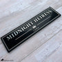 Black personalized horse stall sign with raised metallic lettering, Rosé Champagne accents, crown emblem, and the horse name Midnight Heiress.