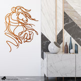 Copper metal wall art of a rearing horse with flowing lines, displayed in a modern setting with marble and geometric accents