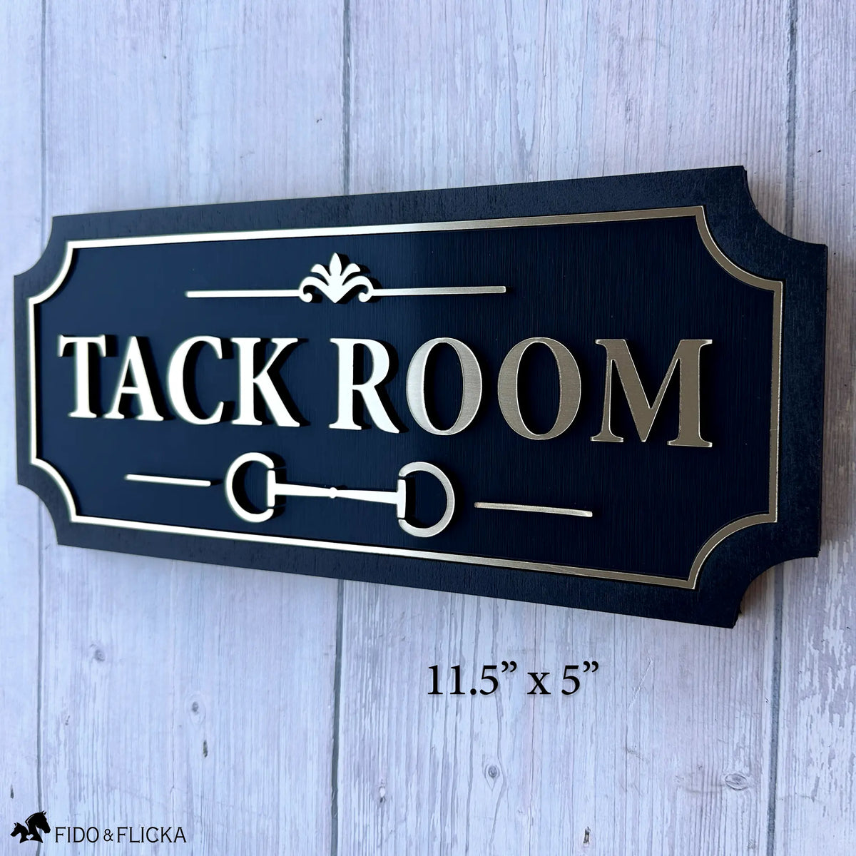 Custom Tack Room barn sign with raised brushed gold lettering, equestrian bit detail, decorative border, and black wood backing.