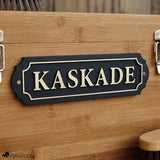 Black acrylic and wood tack room nameplate with brushed gold lettering reading 