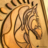 Close-up angled view of a handcrafted layered wood horse head wall art, showcasing detailed carving, smooth contours, and varied wood stains that enhance the dimensional texture. The horse’s mane and features are intricately formed, highlighting the craftsmanship against a warm wooden background.